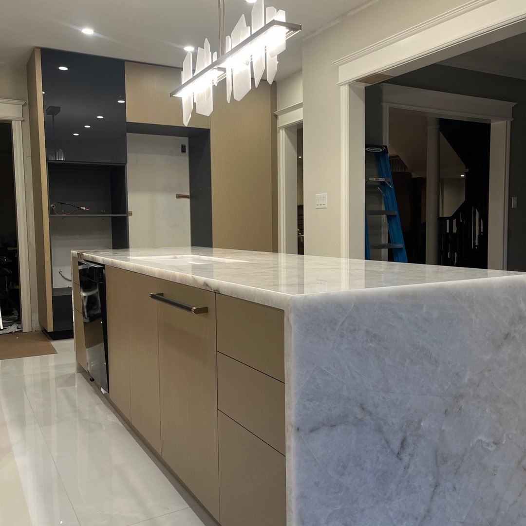 Custom kitchen island and base cabinets installed as part of modern millwork project in Etobicoke, ON
