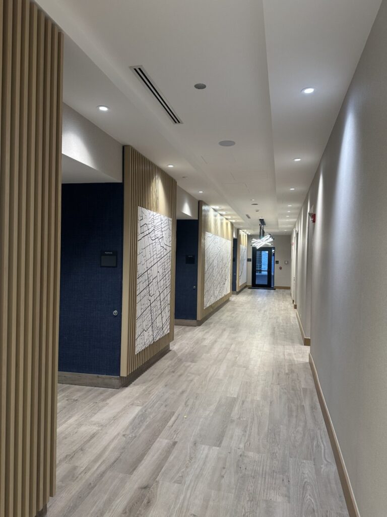 Architectural wood paneling and feature wall millwork installation in Toronto commercial space