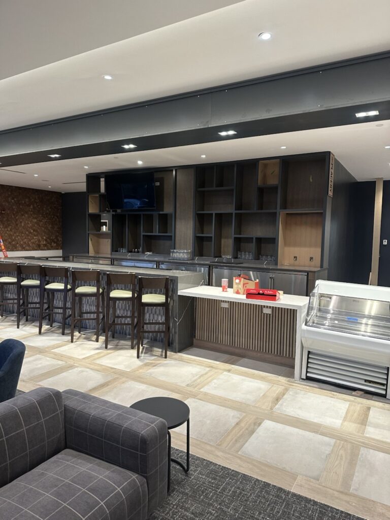 On-site commercial millwork installation including custom cabinetry and built-in wall units in Toronto office interior