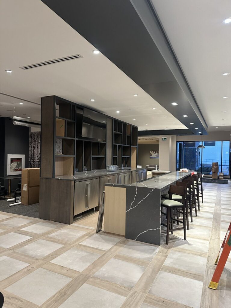 Commercial restaurant millwork installation with custom bar cabinetry and shelving in Toronto