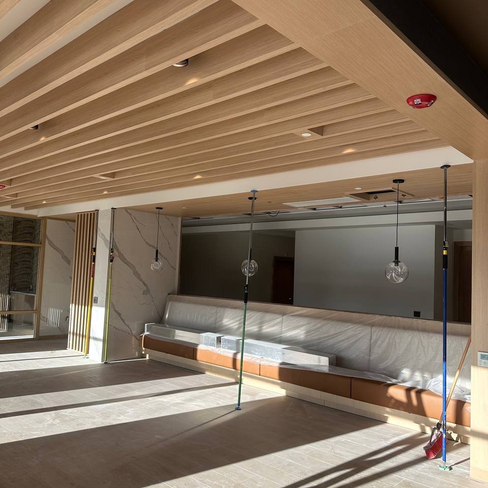 Decorative wood slat ceiling installation detail in Toronto commercial space