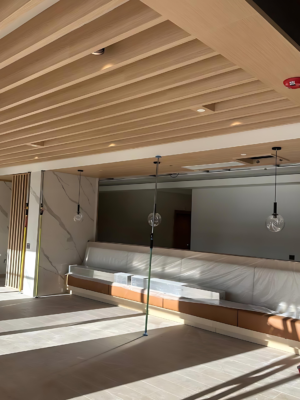 Decorative wood slat ceiling installation detail in Toronto commercial space